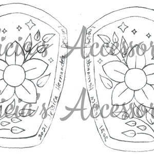 May include: A pair of black and white iron-on patches with a floral design, a crescent moon, and stars. The patches have the text "Jessica Hernandez Designs" and "2021" on one patch and "2021" and "Isaac" on the other patch.