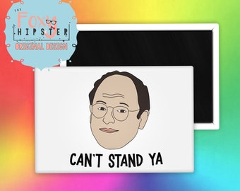 May include: A white rectangular magnet featuring a cartoon illustration of a man with glasses and the phrase "CAN'T STAND YA" in black text. The magnet is a design from "The Foxy Hipster".