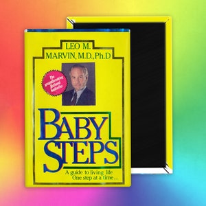 May include: A yellow book cover with the title "Baby Steps" in blue letters. The author is Leo M. Marvin, M.D., Ph.D. The book is described as a "groundbreaking national bestseller" and a guide to living life one step at a time.