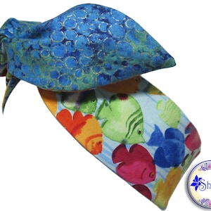 May include: A blue and green headband with a fish pattern. The headband is tied in a knot at the top.