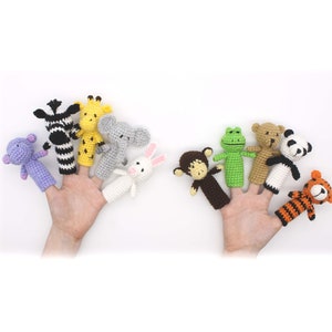 May include: Set of ten finger puppets featuring various animals, including a zebra, giraffe, elephant, rabbit, monkey, crocodile, bear, panda, and tiger. The puppets are made of crocheted yarn in various colors.
