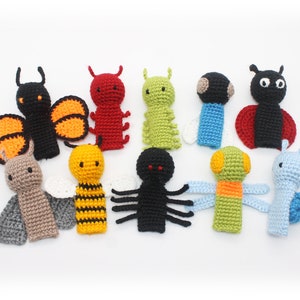 May include: Set of ten crocheted finger puppets featuring various insects, including a butterfly, ladybug, bee, spider, caterpillar, and snail. The puppets are made in a variety of colors, including black, red, yellow, green, and blue.