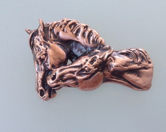 Copper finish nuzzling horses pewter pendant only.  Authentic original design Zimmer