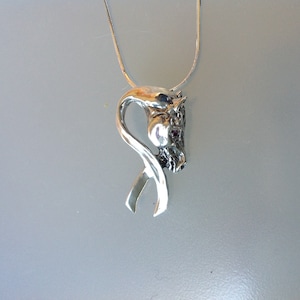 Breast Cancer Awareness ribbon with a horse.  Stone set eye. Sterling silver necklace with chain.