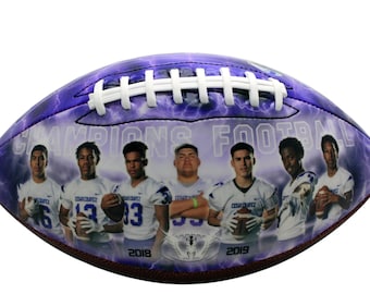 May include: A purple and white American football featuring the text "CHAMPIONS FOOTBALL" and images of football players. The ball has white laces and a lightning bolt design. The years 2018 and 2019 are also visible.