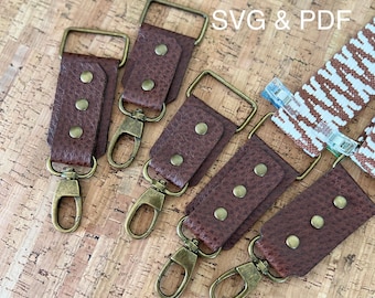 May include: Close-up of several brown leather bag straps with brass-colored hardware, including rectangular buckles and swivel clasps. Each strap is secured with three brass rivets. The text "SVG & PDF" is visible in the upper right corner.