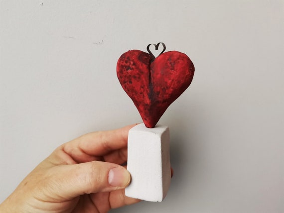 Ceramic heart sculpture, ceramic red heart of stoneware clay on white, polygon base, decorative rustic heart on small pedestal