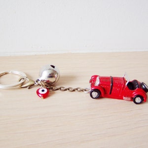 Antique car key chain with bell and eye in red or yellow | Etsy