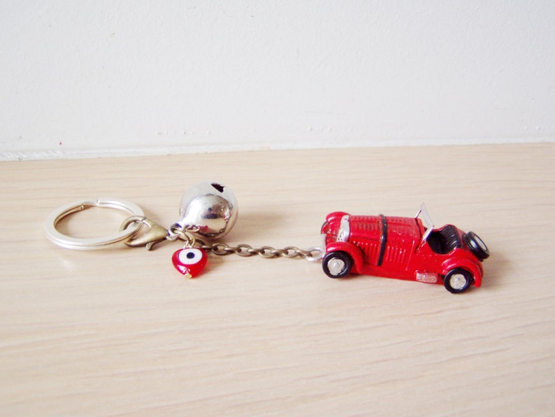 Antique car key chain with bell and eye in red or yellow | Etsy