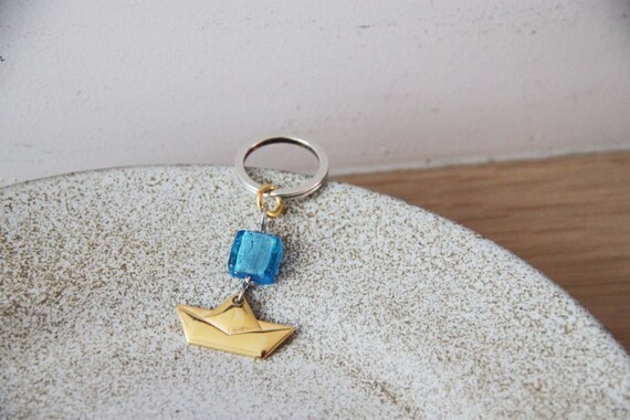 Gold, paper boat key chain, small sailboat key ring, gold plated alloy, boat charm and with blue, glass bead, Greek paper boat key chain