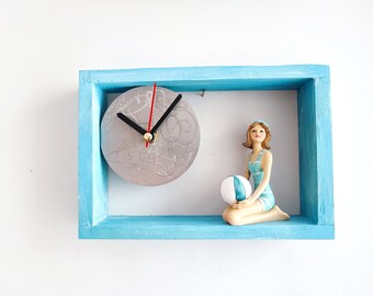 Retro swimmer clock,  retro girl swimmer holding ball, resin sculpture in wooden frame clock, blue clock of retro lady swimmer with  ball