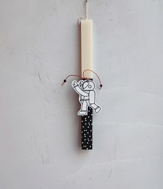 Astronaut Easter candle, paper cutout of astronaut on white, Greek Easter candle, beige, Greek Easter candle with boy astronaut