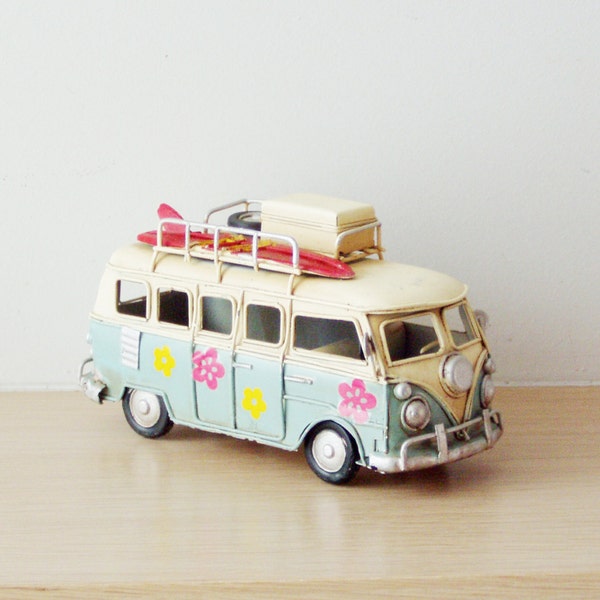 Hippie VW retro van, summer of love van miniature, retro collectible toy of a Volks Wagen hippie van in sky blue and cream with pink flowers