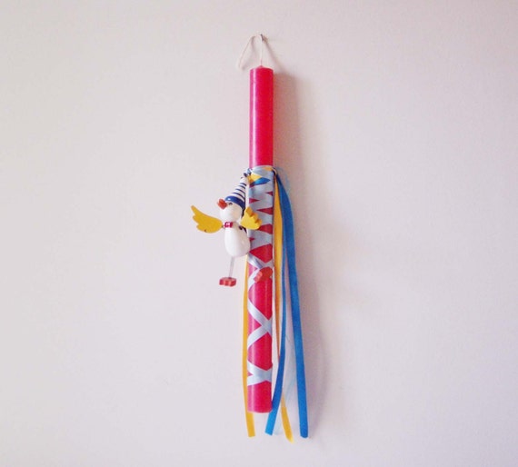 Red Greek Easter candle with wooden toy, Easter candle for kids with yoyo wooden flying duck and blue satin ribbons