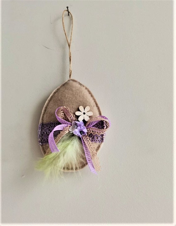 Beige Easter egg, decorative Easter egg ornament, beige purple, felt egg plushie with ribbon, bow, flower and feather