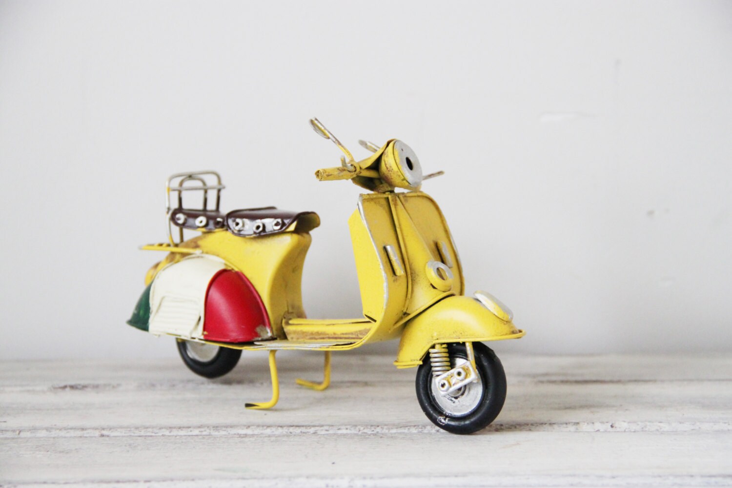 Yellow retro scooter, vintage, collectible, retro miniature, tin and