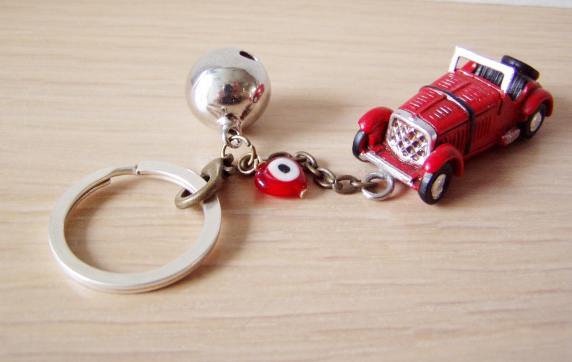 Antique car key chain with bell and eye in red or yellow | Etsy