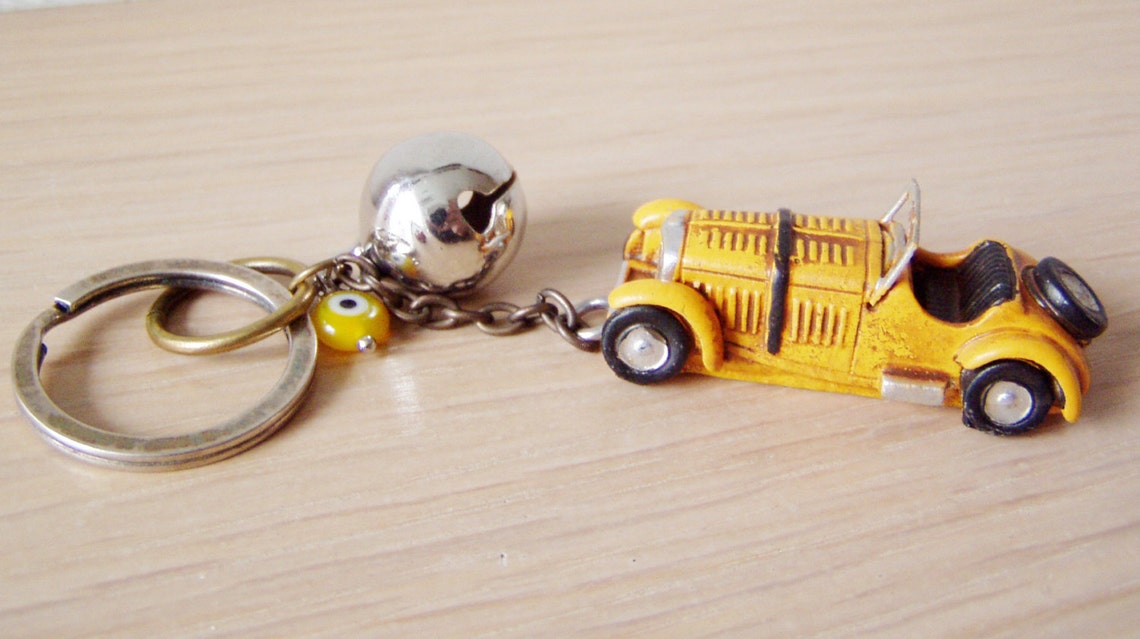 Antique car key chain with bell and eye in red or yellow | Etsy
