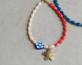 Colourful beaded bracelet, red, cream and blue bracelet with brass flower, spring colours bracelet for girls and teeens