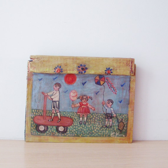 Kids at play painting on reclaimed wood,  vintage, Greek folk art, salvaged wood with folk theme of kids with scooter, candy floss and kite