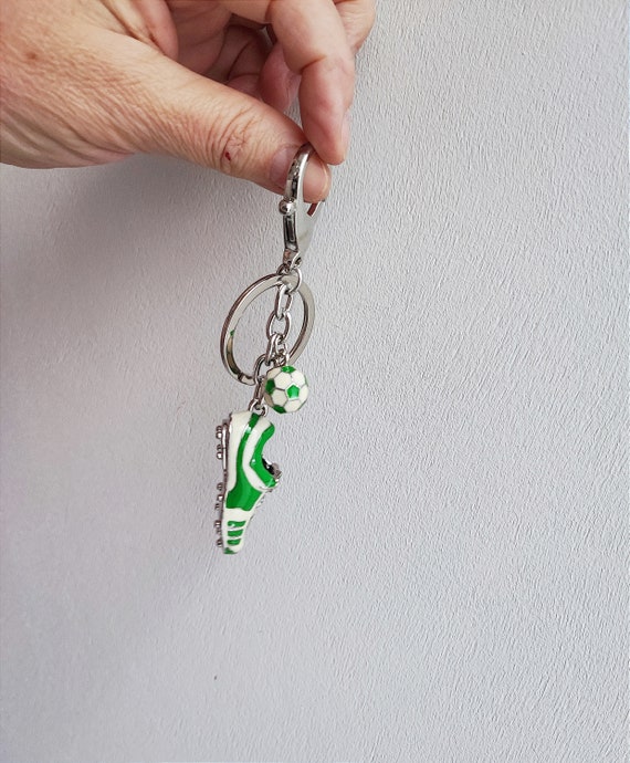 PORTE CLEF BALLON DE FOOT BLANC NOIR S OUVRE