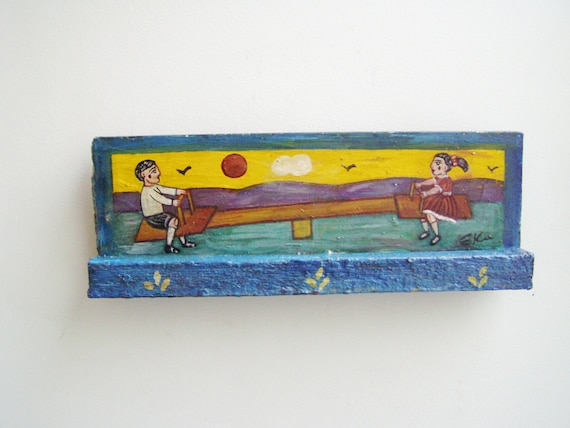 Children on seesaw, vintage, folk painting of boy and girl on a seesaw, Greek folk art, art brute, salvaged wood painting, early nineties