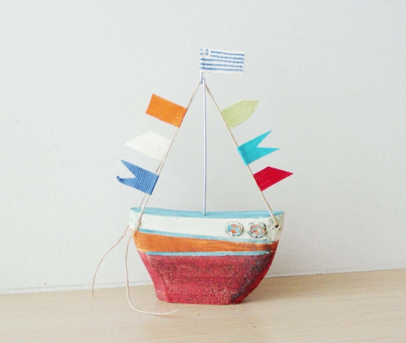 Ceramic sailing boat with colourful flags, stoneware clay boat outline sculpture with wire mast and fabric flags