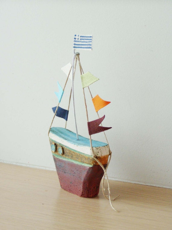 Ceramic sailing boat with colourful flags, stoneware clay boat sculpture with wire mast and fabric flags, Greek pottery boat