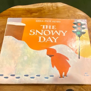 The Snowy Day by Ezra Jack Keats Scholastic Books, 1966 - First Printing, 2nd Edition.