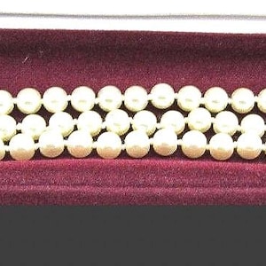 JBK Jackie Kennedy Triple Strand Faux Pearl Bracelet: Sapphire Clasp