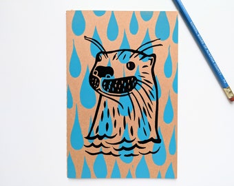 Block Print Notebook - Otter in black with blue raindrops - unruled pages