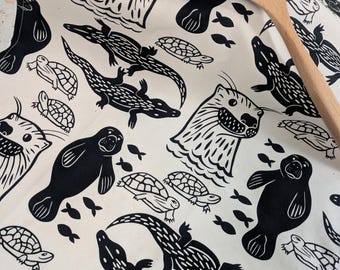 Florida River Animals Cotton Tea Towel - black and white otter, manatee, alligators and turtle dish towel