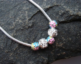 Necklace with enamel flower charm beads