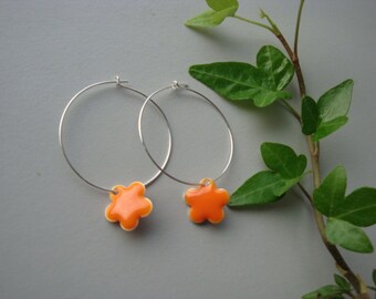 Orange beaded creole hoop earrings