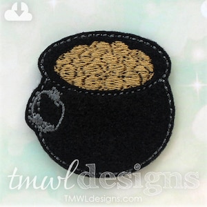 May include: A black felt pot filled with gold coins. The pot has a gray handle and is a traditional Irish symbol.