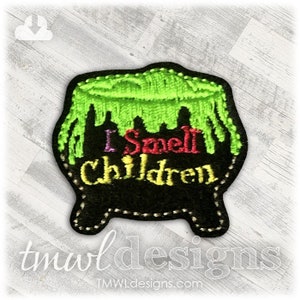 May include: A black cauldron with green dripping slime and the text "I Smell Children" in colorful letters.