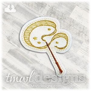 May include: White felt applique with a gold embroidered wand and a golden swirl. The wand is brown and has a gold tip. The swirl has five gold stars.