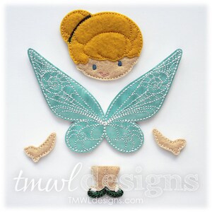 May include: A felt applique set featuring Tinkerbell, with a yellow hair, a light blue dress, and green shoes. The set also includes two beige wings and two beige shoe shapes.