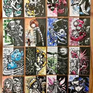 May include: A set of 16 illustrated cards, each divided in half with a different image on each side. The images are drawn in black ink and coloured with watercolour. The cards feature a variety of characters and creatures, including a skull, a bird, a bear, a mushroom, a flower, and a fairy.