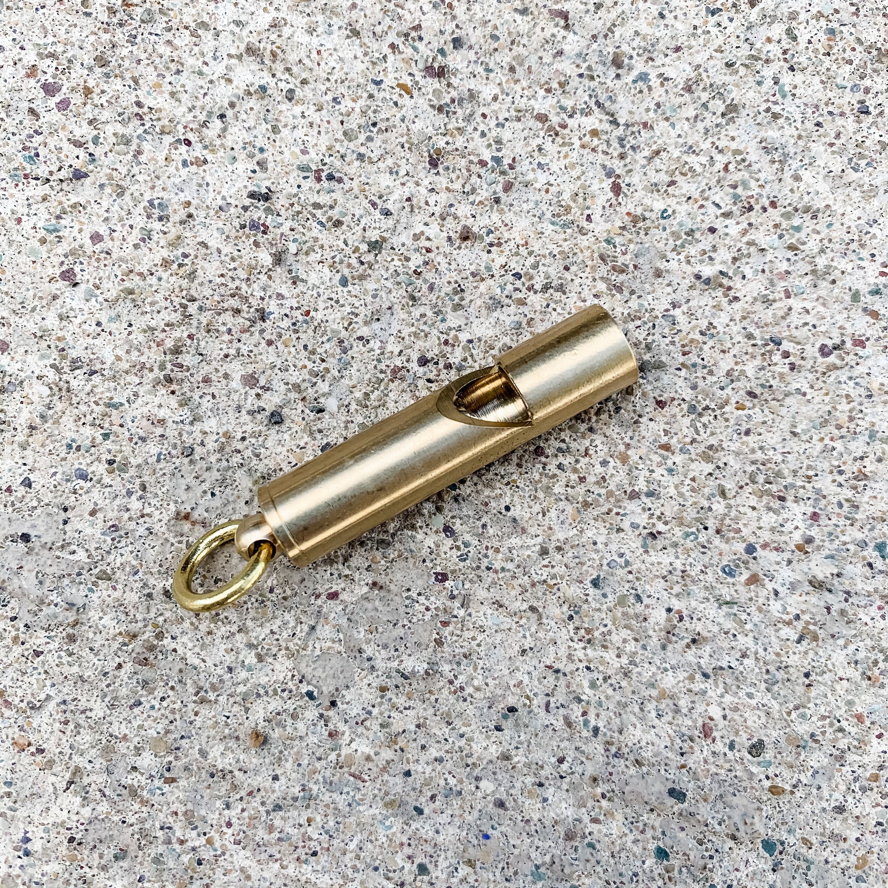 Brass emergency whistle add-on