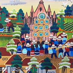 May include: A colorful painting depicting a village scene with a large pink church in the background. People in blue and red clothing are gathered in front of the church, while others are working in the fields. The painting is done in a naive style with bright colors and simple shapes.