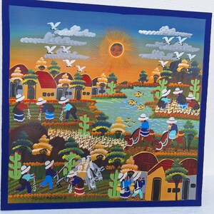 May include: A colorful painting depicting a rural scene with houses, a river, and people. The painting is done in a folk art style with bright colors and simple shapes. The sun is shining brightly in the sky, and there are birds flying overhead. The painting is signed "Tom&aacute;s Ramirez" in the lower right corner.