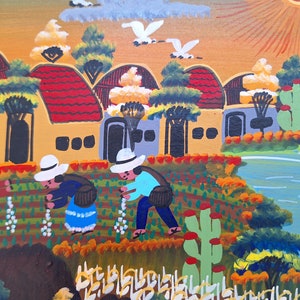 May include: A colorful painting depicting a rural scene with houses, trees, a river, and people working in a field. The houses are yellow with red roofs and white windows. The trees are green and the river is blue. The people are wearing hats and traditional clothing. The painting is done in a folk art style.