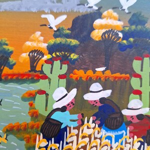 May include: A painting of three people wearing white hats harvesting yellow crops in a field. The painting has a bright, colorful style with a green, orange, and yellow color scheme.