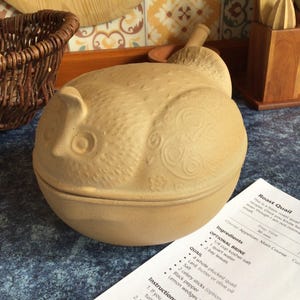 May include: A set of three ceramic mugs with a speckled, matte finish. The mugs are in shades of cream, light gray, and dark gray. Each mug has a simple, minimalist design, perfect for coffee or tea.