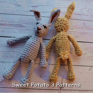 May include: Two crocheted bunny toys, one light blue and one tan, on a white wooden background. The text "Sweet Potato 3 Patterns" is at the bottom of the image.