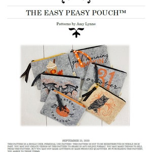 May include: Five different felt pouches with various Halloween-themed embroidery designs. The pouches are grey, beige, and brown. The designs include a pumpkin, a bat, an owl, a coffee cup, and a fall leaf. The text on the pouches reads "good morning pumpkin", "october", "grateful blessed thankful", and "good morning pumpkin".