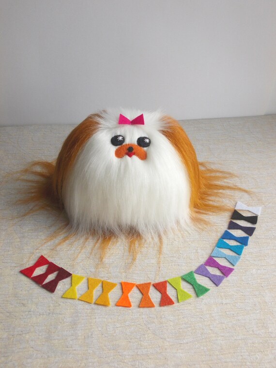 white fluffy dog toy