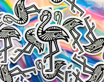 May include: A collection of black and white skeleton flamingo stickers. The stickers are on a rainbow iridescent background.