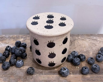 The french butter dish with a blueberry pattern